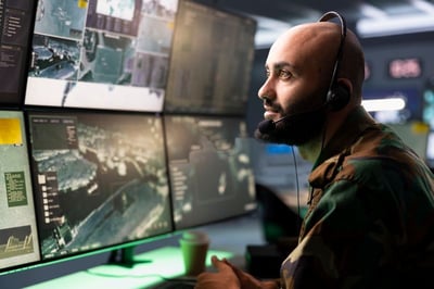 Intelligence analyst at a command center. Modern defense requires persistent awareness — and collaboration at speed. Bluescape empowers teams to plan, test, and respond to emerging threats with confidence.