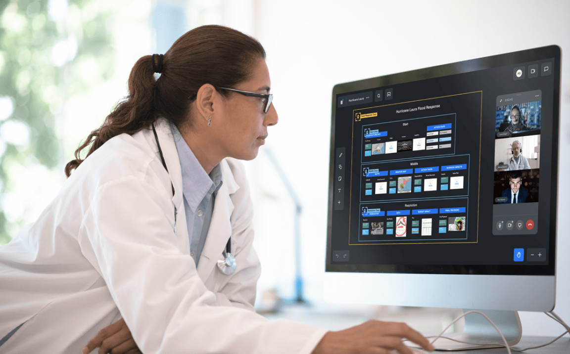 Professional in lab coat reviewing workspace for situation awareness